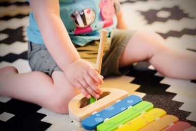 child plating on carpet